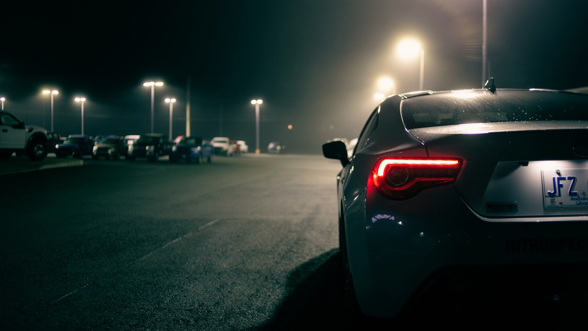 Vehicle loitering in parking lot at night