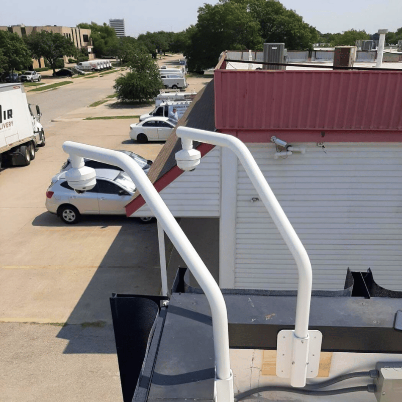 pole-mounted security cameras installed by 2m technology overlooking a parking lot
