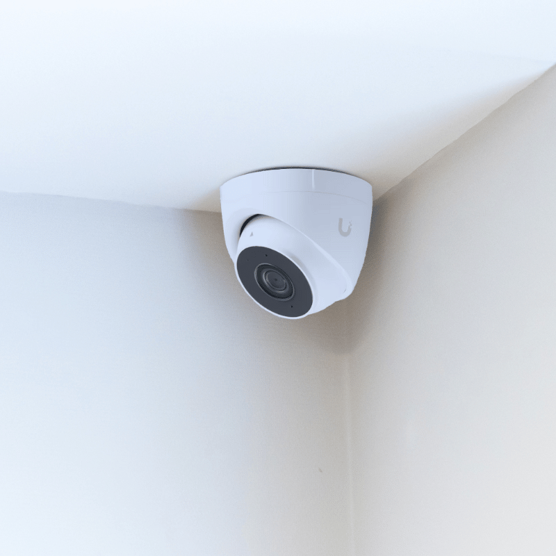 Ubiquiti Unifi turret camera mounted in the corner of a ceiling