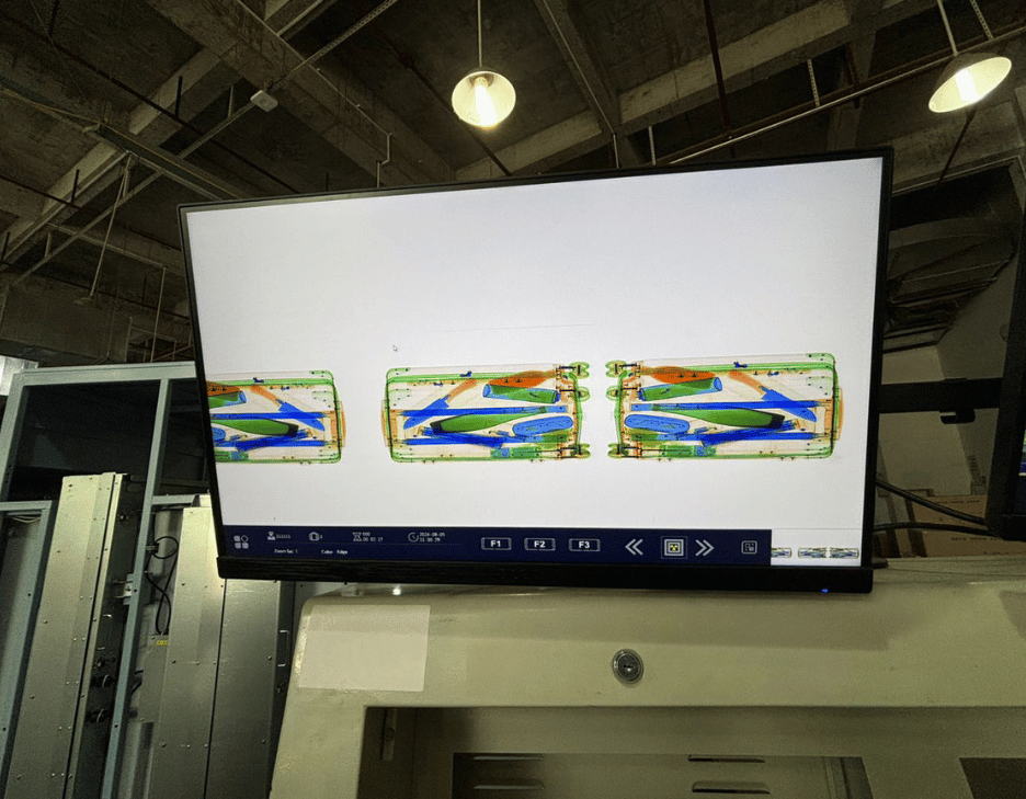 Example X-ray image of luggage on monitors of 2M Technology's AI-enabled 2MX-150180 Heavy Duty X-Ray Pallet and Cargo Scanner