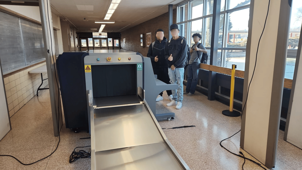 Students from Proviso West High School posing in front of 2M Technology 2MX-6550 x-ray machines