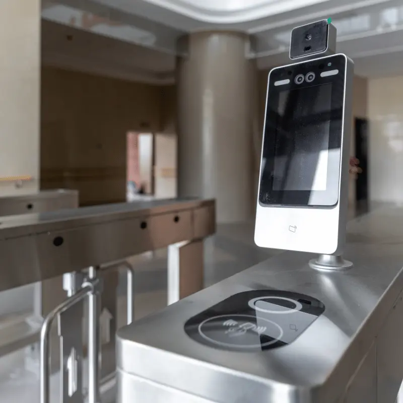 face recognition terminal mounted on access control turnstile inside office building