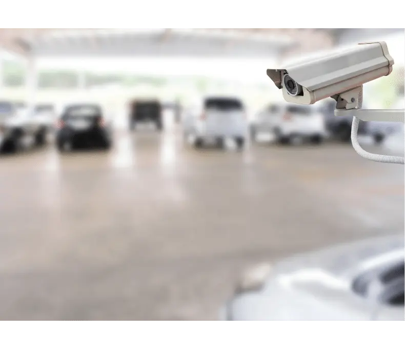 bullet camera monitoring vehicles in parking garage