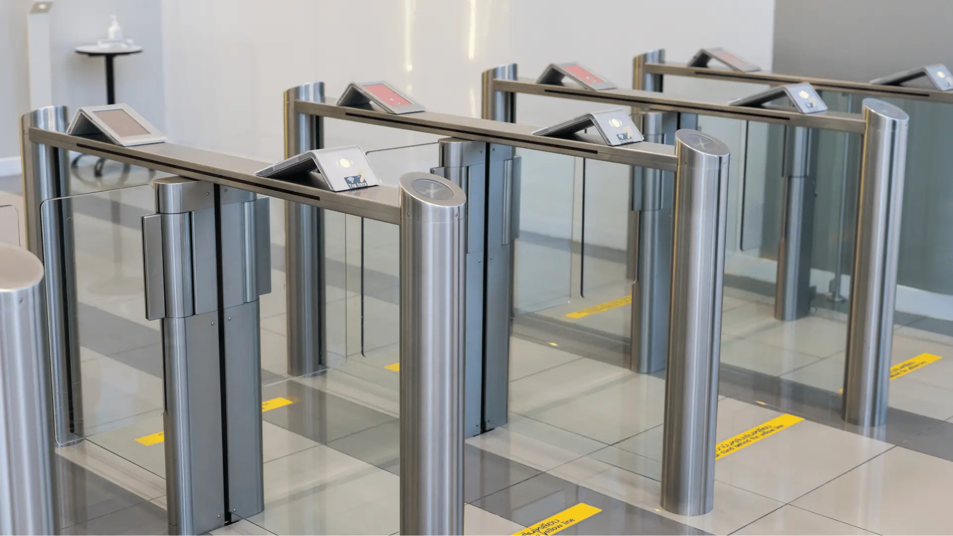 line of access control turnstiles inside corporate building