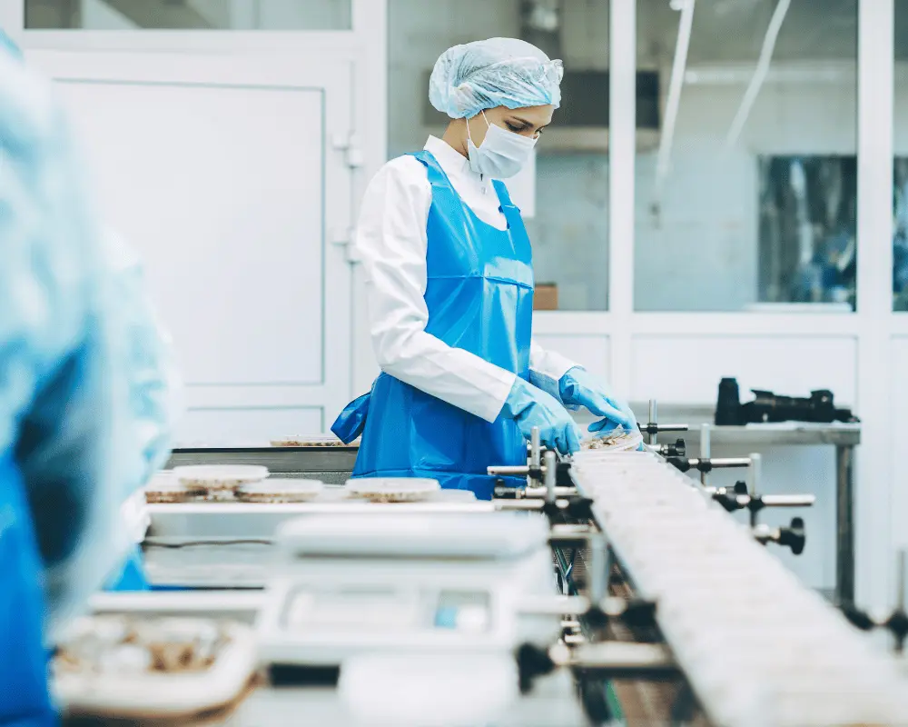 Manufacturing worker at a conveyor belt