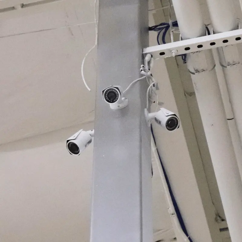 2M Technology installation of 3 bullet cameras mounted to indoor support beam