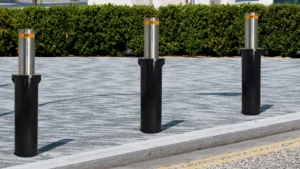 A row of 2M Technology hydraulic security bollards surrounding a pedestrian area.